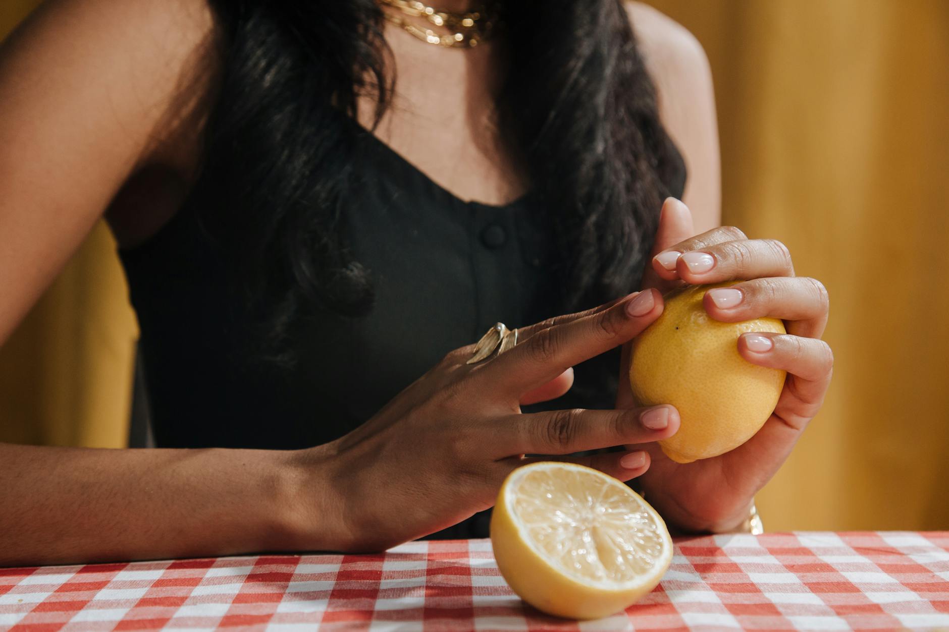 Fresh lemons on a bright yellow background, symbolizing renewal and gentle healing.
